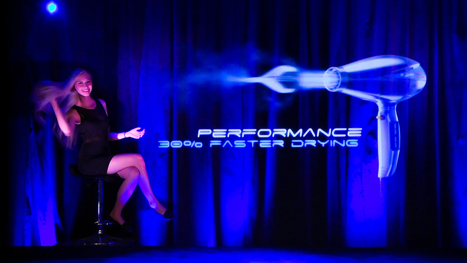 A character and a digital hair dryer model sharing the stage