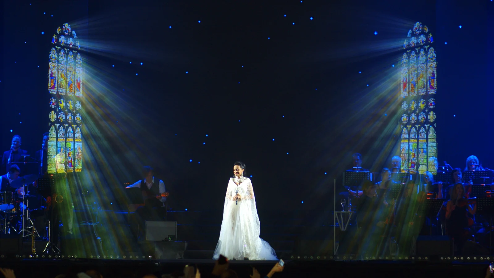 Concert stage with stained-glass imagery — Lucie Bílá Christmas gala concert, SCREENRENTAL.EU